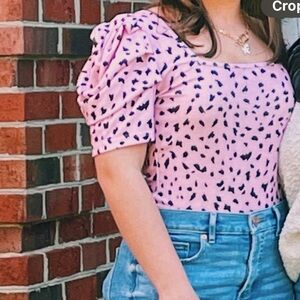 pink and black patterned top with cute short sleeves